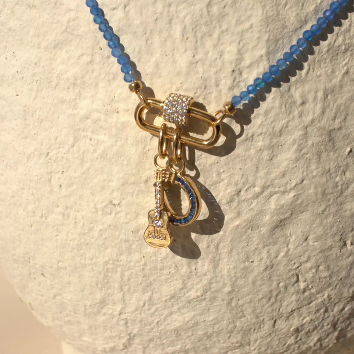 LOYAL CRYSTAL HORSESHOE CHARM - BLUE CUBIC ZIRCONIA