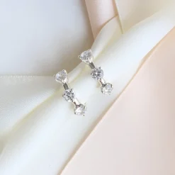 SCATTERED LOVE HUGGIE HOOPS - CUBIC ZIRCONIA & SILVER
