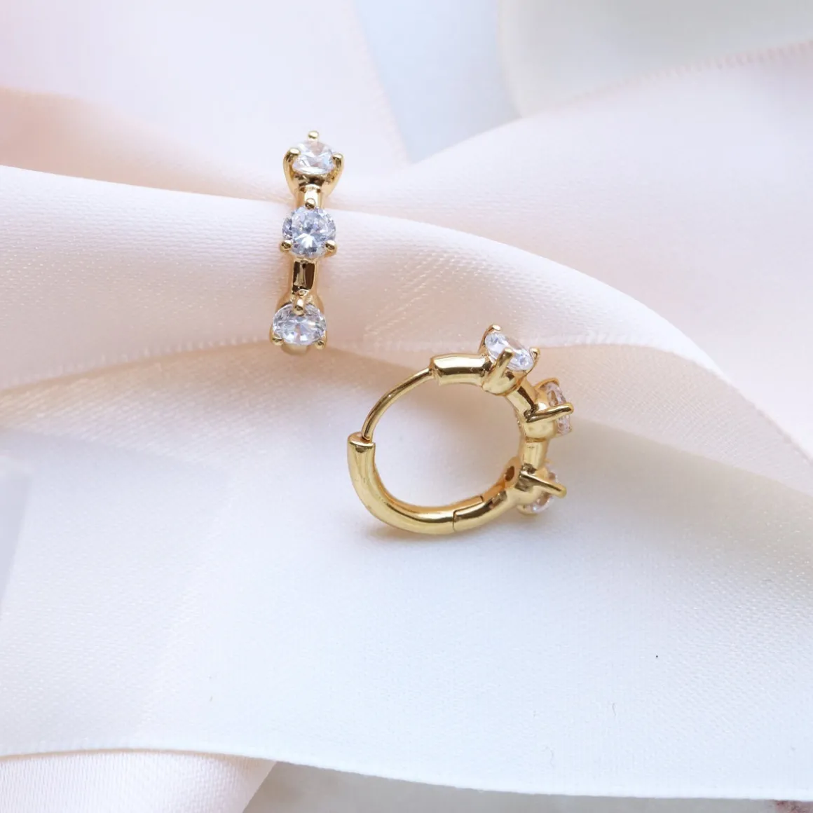 SCATTERED LOVE HUGGIE HOOPS - CUBIC ZIRCONIA & GOLD