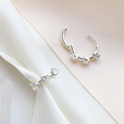 SCATTERED LOVE HUGGIE HOOPS - CUBIC ZIRCONIA & SILVER